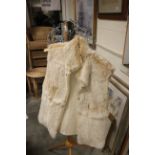 A white fur waistcoat