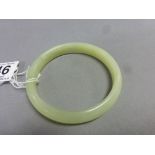 A Chinese pale green hard stone bangle