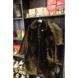 A ladies faux fur jacket. along with a fur muff