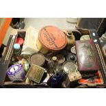 A collection of vintage tins, bottles and other items