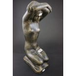 A large plaster figure of a female nude