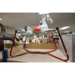 A vintage Mobo metal rocking horse on stand