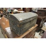 A vintage studded trunk, with paper label D Wallace Bristol