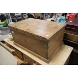 A vintage pine blanket/tool box with a hinged lid