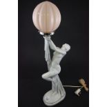 A plaster Art Deco style lamp with standing figure of a lady