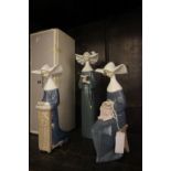 Three Lladro figure of nuns, one boxed