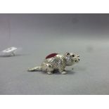 Silver Pin Cushion of a Dog carrying a bone with ruby eyes