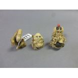 Three netsuke style carvings to include Old Man Traveller