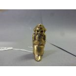 Brass Cased Vesta in the form of a Seated Child