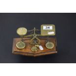 Early 20th century Brass Postal Scales and Weights on Oak Base