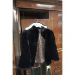 A vintage black fur jacket