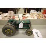 A tin plate tractor with key