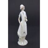 A Lladro figure of a nurse