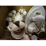 A collection of mixed dinnerware including Poole pottery, Royal Worcester Evesham and others