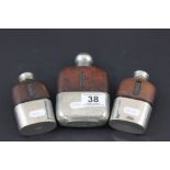 Three leather and silver plated mounted hip flasks