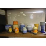 A collection of 10 Shelley vases, various sizes and colours