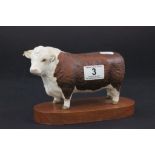 Beswick ' Hereford Bull ' on wooden plinth