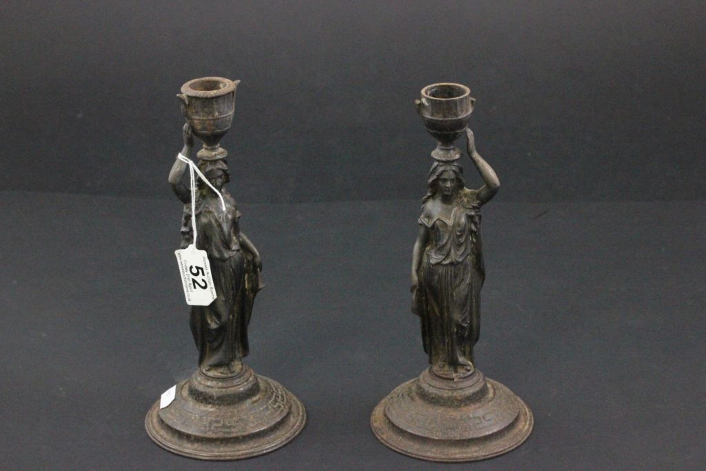 A pair of spelter candlesticks in form of ladies