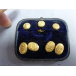 Boxed yellow metal cufflink and stud set