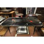 Retro Coffee Table, Black with Gold and Red Design, raised on atomic legs