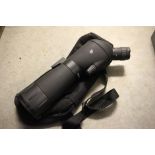 A cased monocular telescope 20-60-x60