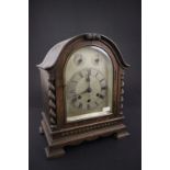 A 20th century oak cased mantel clock with an eight day movement