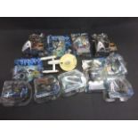 Group of carded action figures to include Tron Legacy x 3, The Golden Compass x 2, Playmates Star