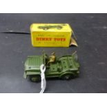 Four boxed Dinky models to include Scout Car,673, playworn, Triumph TR2 sports, 105, gd with some