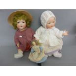 Two Armand Marseille bisque head composition dolls to include baby with sleeping eyes marked AM