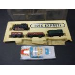 Trix Express locomotive with 3 trucks within Trix Express packaging plus a Japanese tin plate