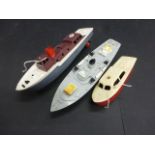 Three Triang plastic model power boats including cruiser