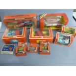 Nine boxed Britains to include M F & Front loader 9595, Wagon loader 9578, Seed Drill 9577, Hay