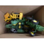 A collection of unboxed diecast models including large John Deere tractors, Corgi and others