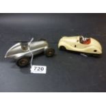 Schuco tin plate Examico 4001 car, in a cream colour, discoloured, with key, along with a silver