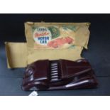 Codeg plastic/bakelite Modern motor car in maroon with poor box