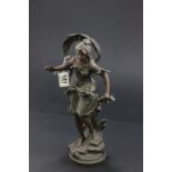 A spelter figure of a lady