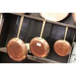 Three Copper Graduating Frying Pans