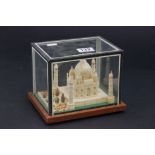 A carved wooden model of a Indian temple