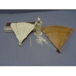 Small early 20th century carved ivory okimono figure and and two fans