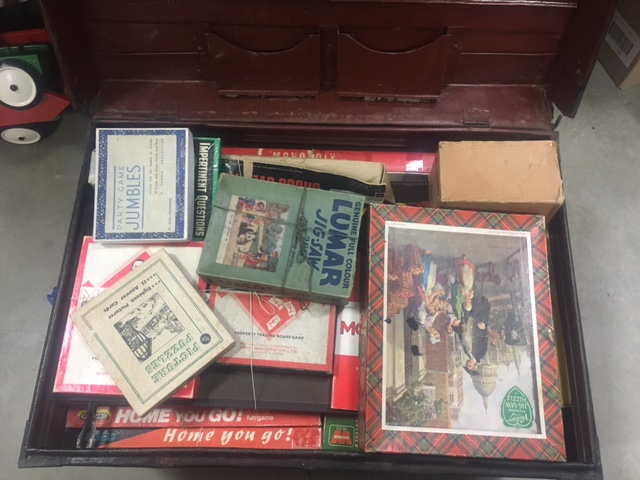 A collection of vintage games, in a tin trunk