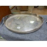 A silver plated oval tray with pierced outline