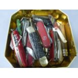 Tin of vintage penknives