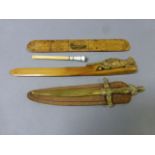 Three vintage letter opener/ page turners to include Mauchline Ware plus an enamel topped