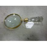 A hand held magnifying glass