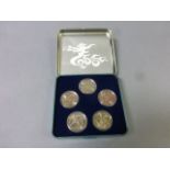 Boxed set of 5 Chinese white metal coins with certificate