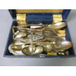 A silver teaspoon with golf clubs and ball, along with a collection of silver plated cutlery