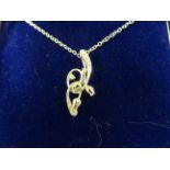 An 18ct white gold and diamond pendant necklace