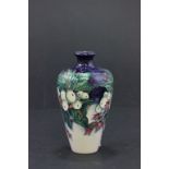 A Moorcroft vase decorated with fruits, circa 2002