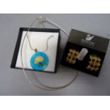 Boxed silver necklace, a pair of Swarovski earrings and a glass pendant