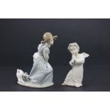 A Lladro figure of a girl and puppy, along with a Lladro figure of an angel playing a musical